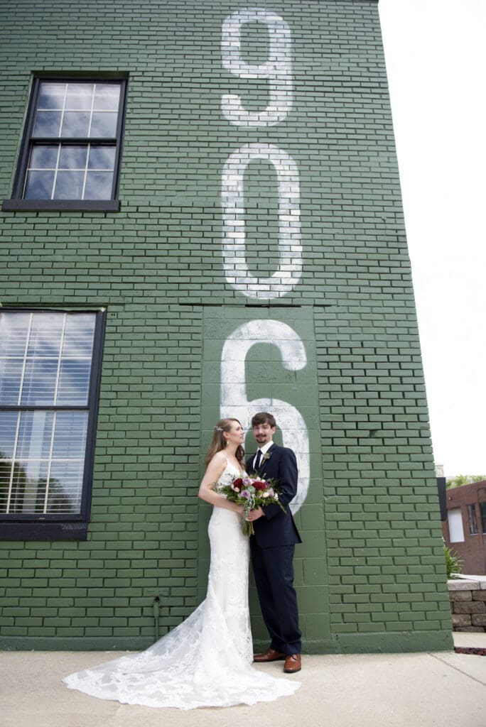 Bride and Groom posing outside a Milwaukee wedding Venue 