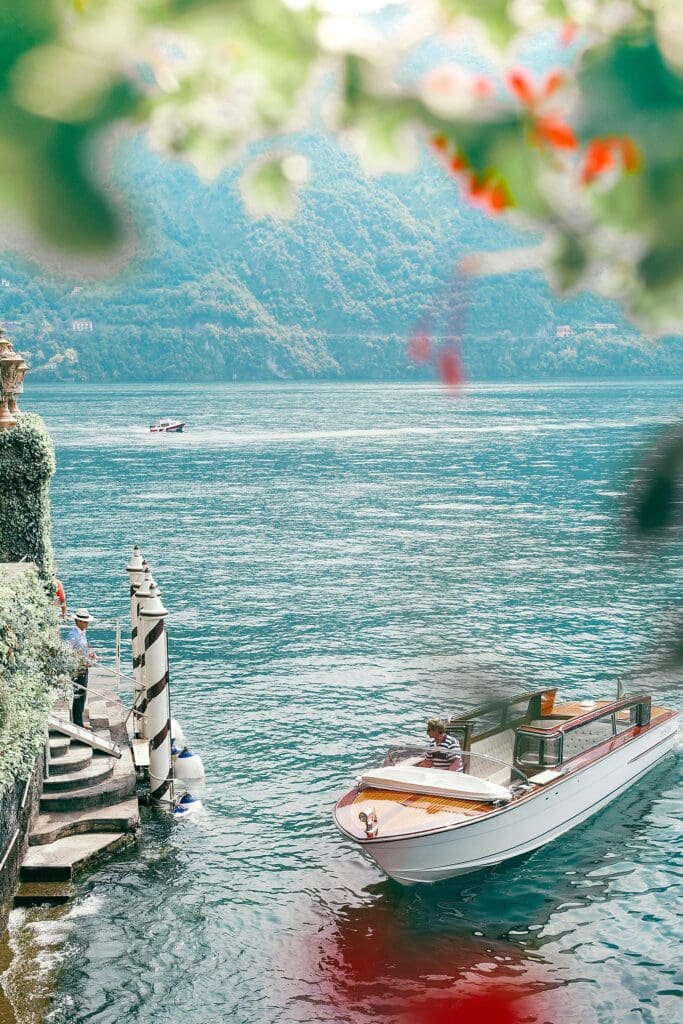 Lake Como in Italy featuring elegant lakeside villas, mountains, and calm blue water, a popular destination for weddings and elopements